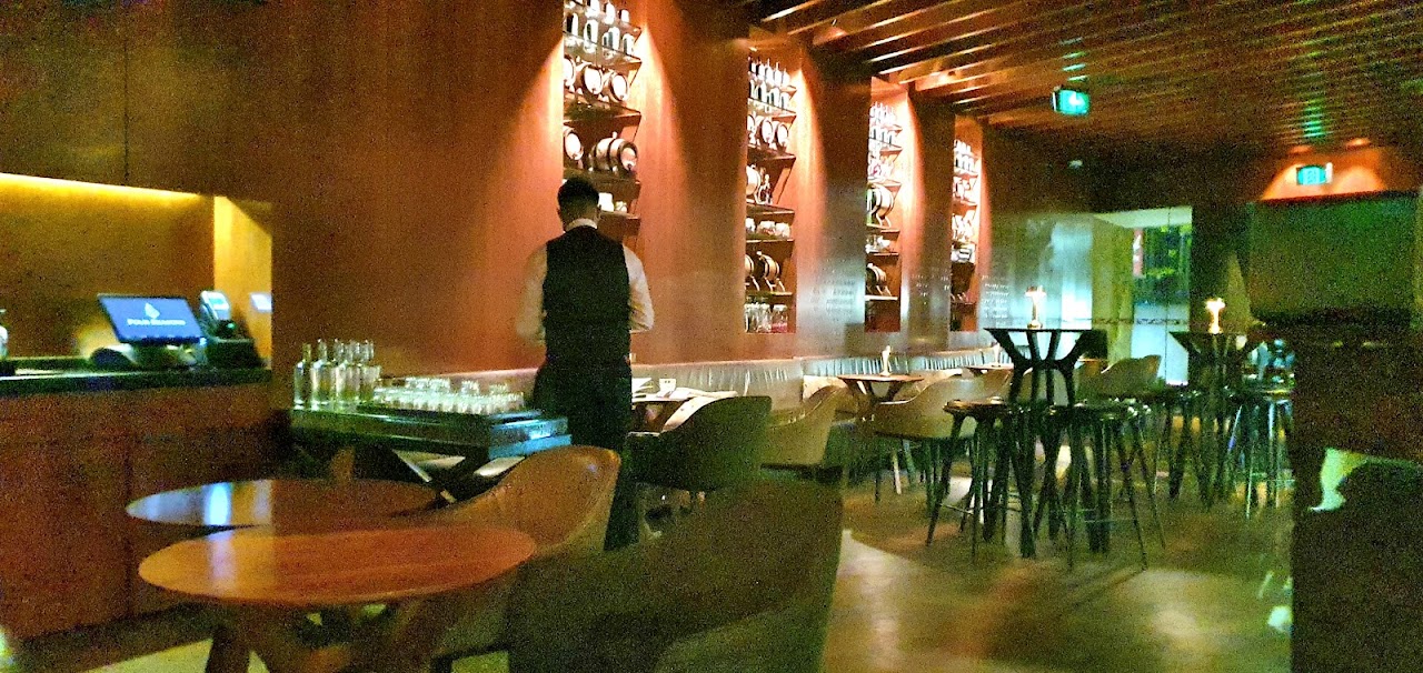 Low-lit lounge seating and tables at Grain Bar